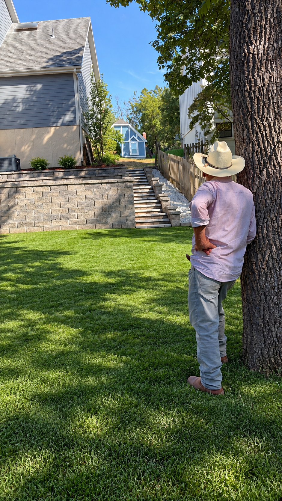Fresh green lawn with retaining wall, landscape steps and backyard improvements in Gardner, Kansas
